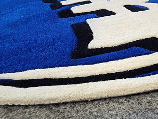 Logo v koberci - Vlněné koberce s logem